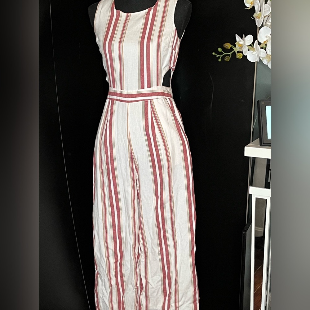 Japna women’s short sleeved jumpsuit with cutouts on each side.